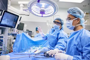 Urulogy Associate Mariepet Ask, MD starting a DaVinci urology surgery in the operating room at Tufts Medical Center.